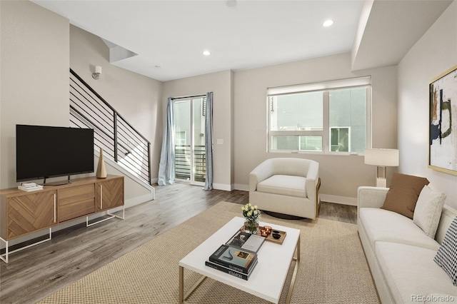 1615 Harlan St Unit 2, Lakewood, CO 80214 - living area featuring wood finished floors, stairway, recessed lighting, and baseboards