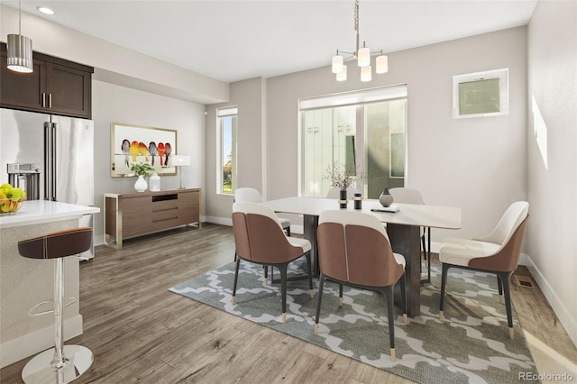1615 Harlan St Unit 2, Lakewood, CO 80214 - dining space featuring light wood-style flooring and baseboards