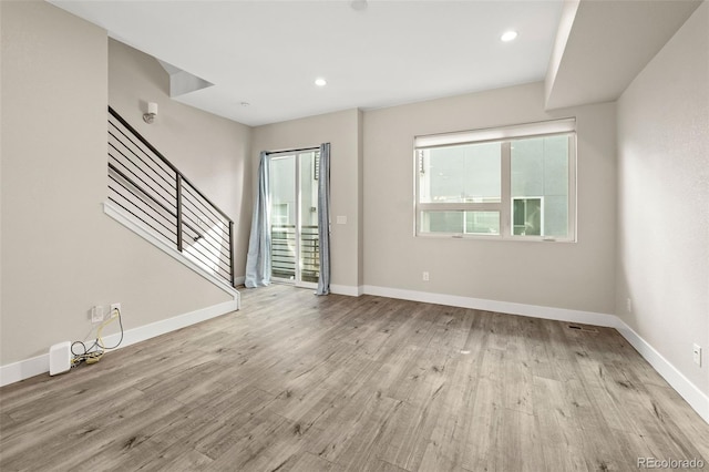 1615 Harlan St Unit 2, Lakewood, CO 80214 - foyer featuring light wood-style floors, stairs, baseboards, and recessed lighting