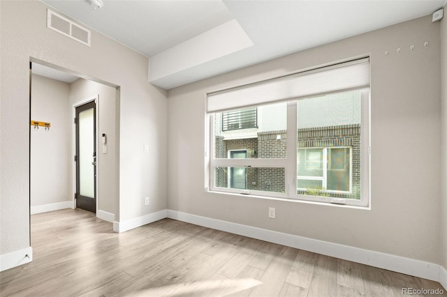 1615 Harlan St Unit 2, Lakewood, CO 80214 - spare room with wood finished floors and baseboards
