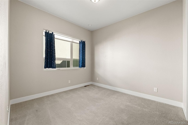 1615 Harlan St Unit 2, Lakewood, CO 80214 - unfurnished room with light carpet and baseboards