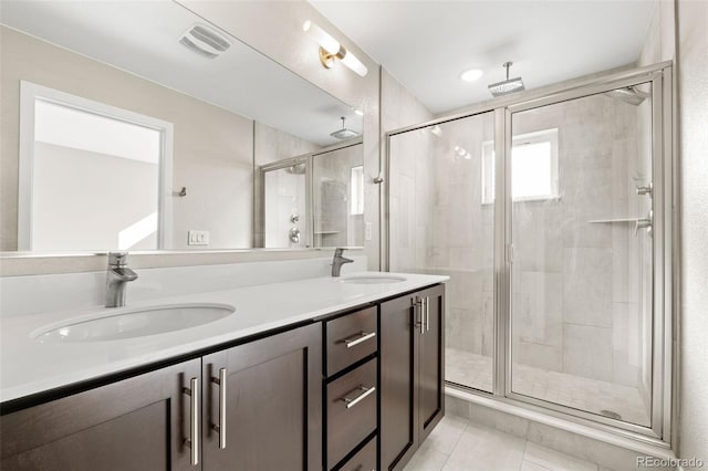 1615 Harlan St Unit 2, Lakewood, CO 80214 - bathroom with a stall shower, tile patterned flooring, and double vanity