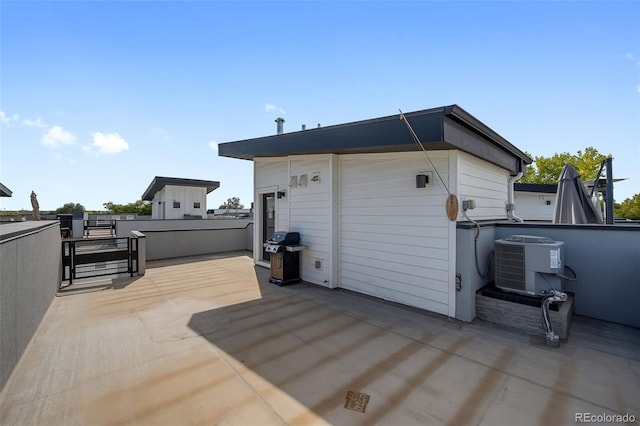 1615 Harlan St Unit 2, Lakewood, CO 80214 - view of patio with a grill and central air condition unit