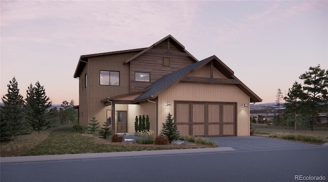 view of front of property featuring a garage and driveway