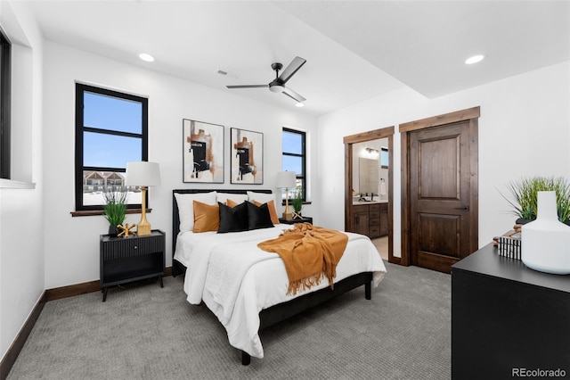 bedroom with visible vents, multiple windows, light colored carpet, and baseboards