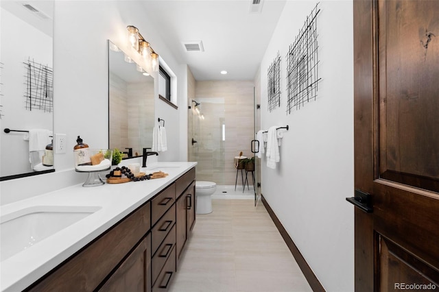 full bathroom featuring double vanity, visible vents, toilet, and a shower stall