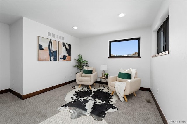 sitting room with visible vents, recessed lighting, baseboards, and carpet