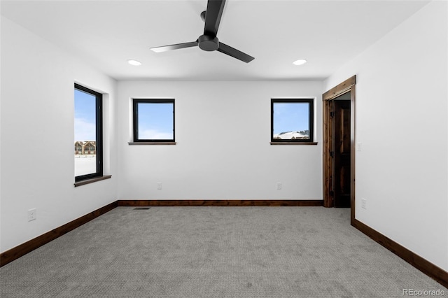 unfurnished room featuring recessed lighting, ceiling fan, baseboards, and carpet