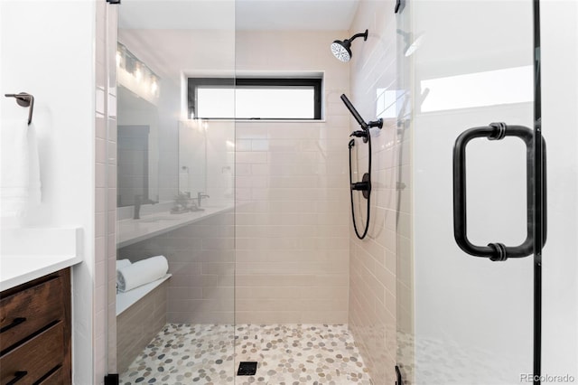 bathroom featuring vanity and a stall shower