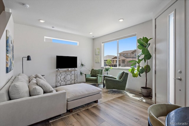 1100 Blue Bell Rd, Berthoud, CO 80513 - living area featuring wood finished floors, recessed lighting, and baseboards