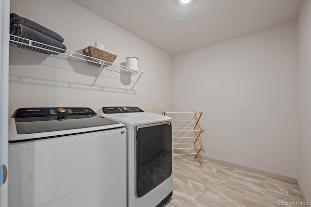 1100 Blue Bell Rd, Berthoud, CO 80513 - washroom featuring washing machine and dryer and baseboards