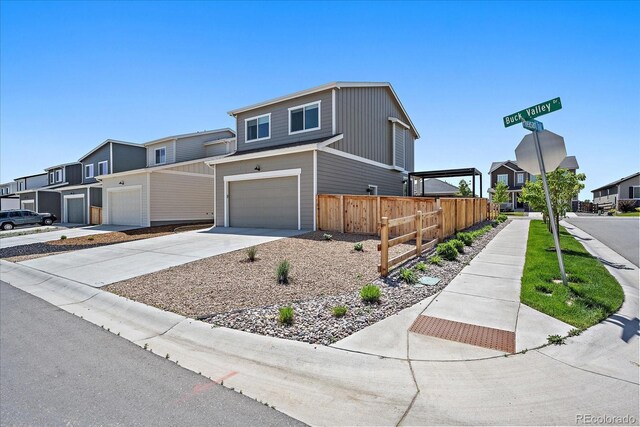 1100 Blue Bell Rd, Berthoud, CO 80513 - view of front of house with an attached garage, driveway, and a residential view
