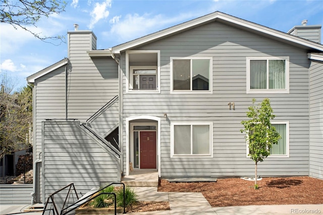 8500 E Jefferson Ave Unit 11C, Denver, CO 80237 - view of front facade with a chimney
