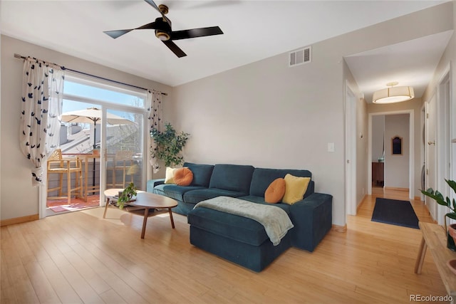 8500 E Jefferson Ave Unit 11C, Denver, CO 80237 - living room with light wood-style floors, ceiling fan, and baseboards