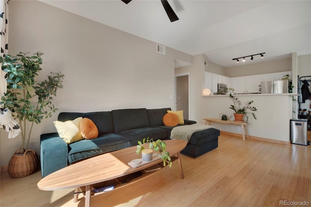 8500 E Jefferson Ave Unit 11C, Denver, CO 80237 - living room with light wood-type flooring, a ceiling fan, and rail lighting