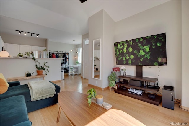 8500 E Jefferson Ave Unit 11C, Denver, CO 80237 - living room featuring light wood-style flooring and rail lighting