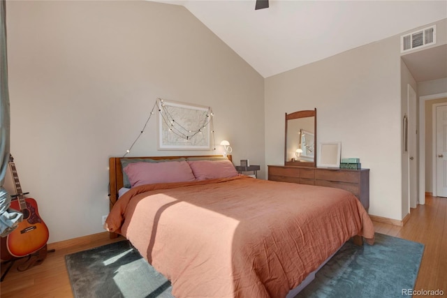 8500 E Jefferson Ave Unit 11C, Denver, CO 80237 - bedroom with wood finished floors, baseboards, high vaulted ceiling, and ceiling fan