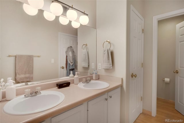 8500 E Jefferson Ave Unit 11C, Denver, CO 80237 - full bath with double vanity and wood finished floors