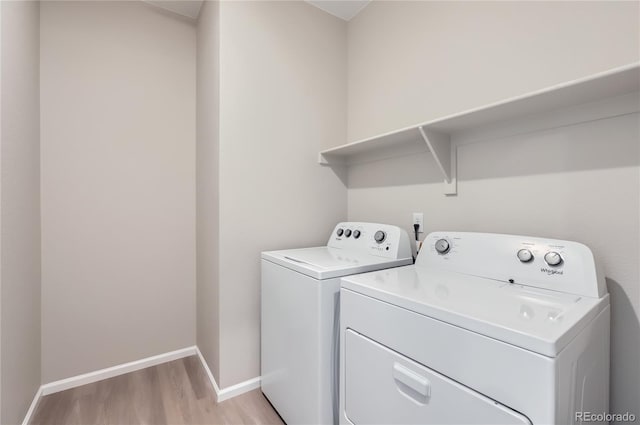 4102 Estrella St, Brighton, CO 80601 - washroom featuring washing machine and dryer and light wood-style flooring