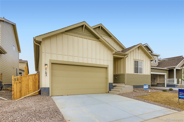4102 Estrella St, Brighton, CO 80601 - view of front facade featuring board and batten siding, a garage, and concrete driveway