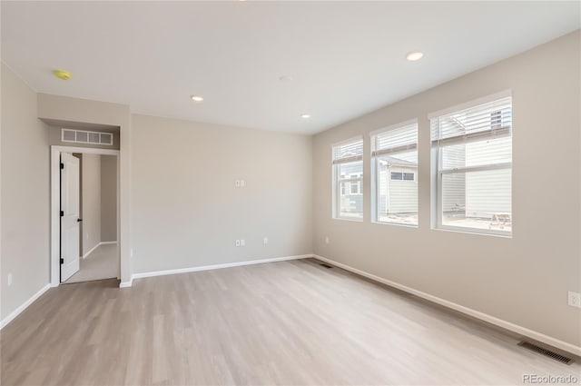 4102 Estrella St, Brighton, CO 80601 - spare room with light wood-type flooring, a smoke detector, and recessed lighting