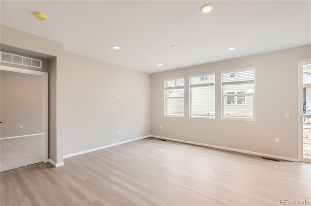 4102 Estrella St, Brighton, CO 80601 - empty room featuring light wood finished floors and recessed lighting