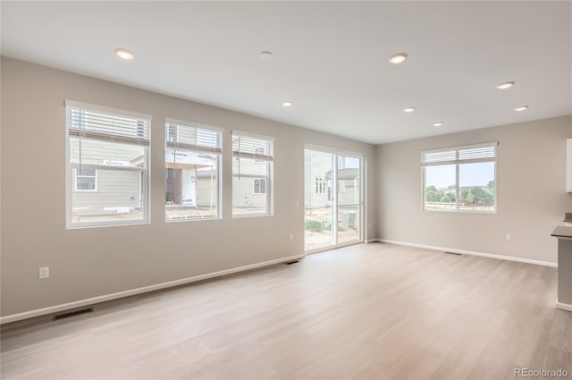 4102 Estrella St, Brighton, CO 80601 - unfurnished living room featuring light wood-type flooring and recessed lighting