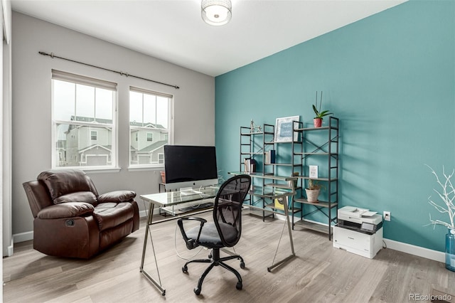 office with baseboards and wood finished floors