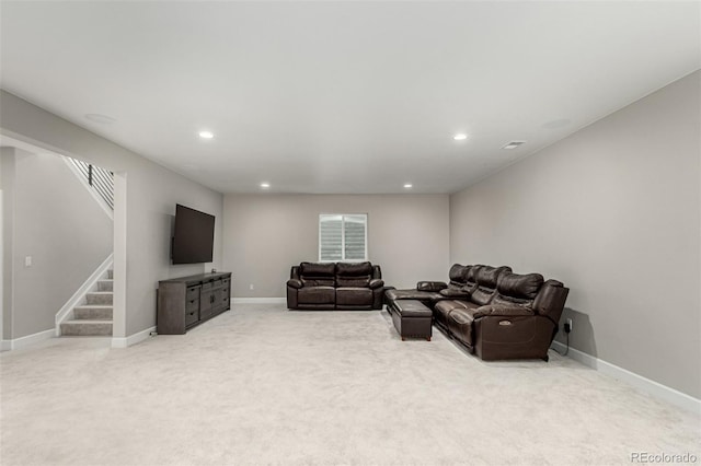 living room with recessed lighting, light carpet, stairs, and baseboards