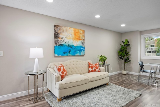 2856 S Kenton Ct, Aurora, CO 80014 - living room featuring wood finished floors, recessed lighting, and a textured ceiling