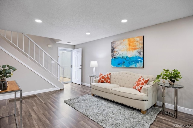 2856 S Kenton Ct, Aurora, CO 80014 - living area with wood finished floors, recessed lighting, stairs, and a textured ceiling