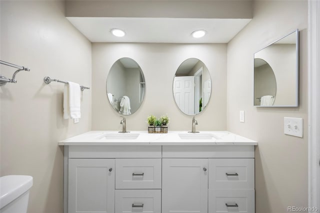 2856 S Kenton Ct, Aurora, CO 80014 - bathroom featuring double vanity and toilet