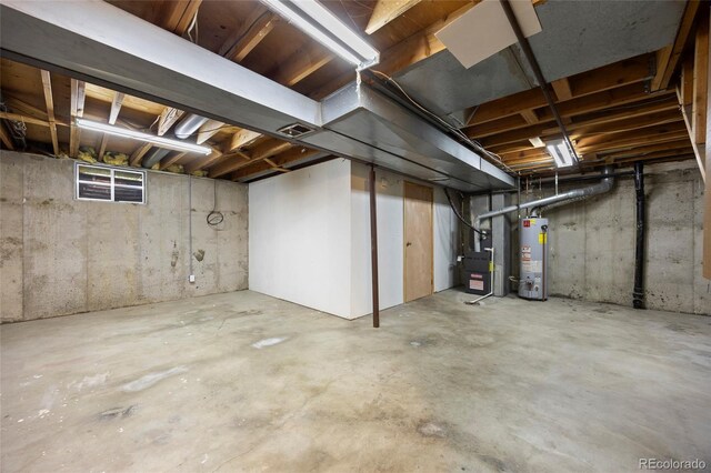2856 S Kenton Ct, Aurora, CO 80014 - unfinished below grade area featuring gas water heater and heating unit