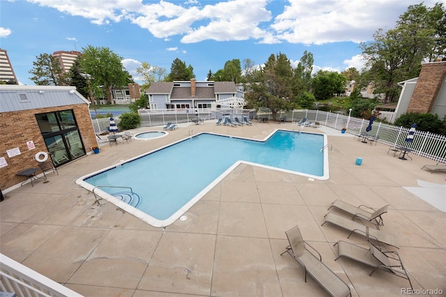 2856 S Kenton Ct, Aurora, CO 80014 - community pool featuring a patio and a hot tub