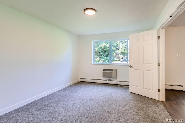 610 S Clinton St Unit 5A, Denver, CO 80247 - unfurnished bedroom with a baseboard heating unit, an AC wall unit, and carpet
