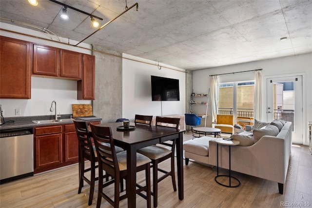 1475 Delgany St Unit 307, Denver, CO 80202 - dining room with light wood-type flooring and track lighting