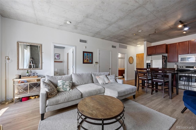 1475 Delgany St Unit 307, Denver, CO 80202 - living area with light wood-style flooring