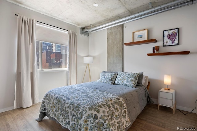 1475 Delgany St Unit 307, Denver, CO 80202 - bedroom featuring wood finished floors