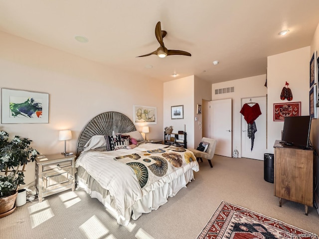 bedroom featuring carpet floors, visible vents, and ceiling fan