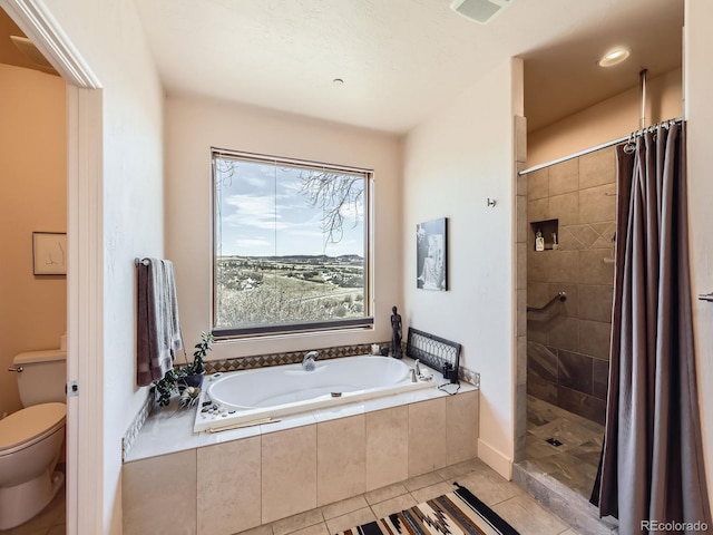 full bath with visible vents, toilet, tile patterned floors, a garden tub, and a tile shower