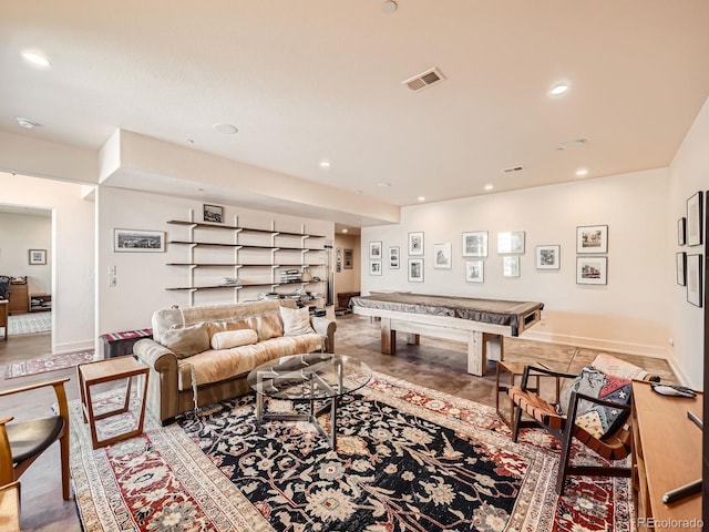 living room featuring baseboards, visible vents, and recessed lighting