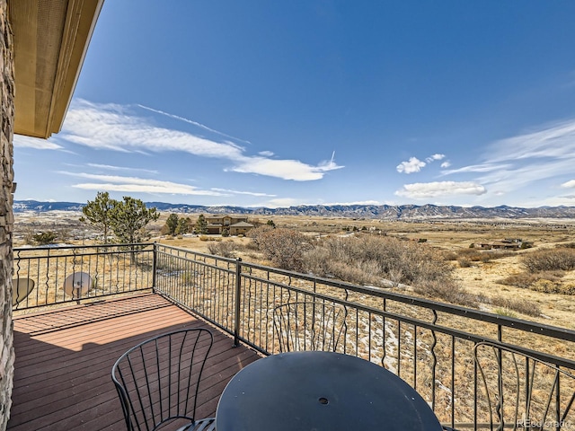 balcony featuring a mountain view