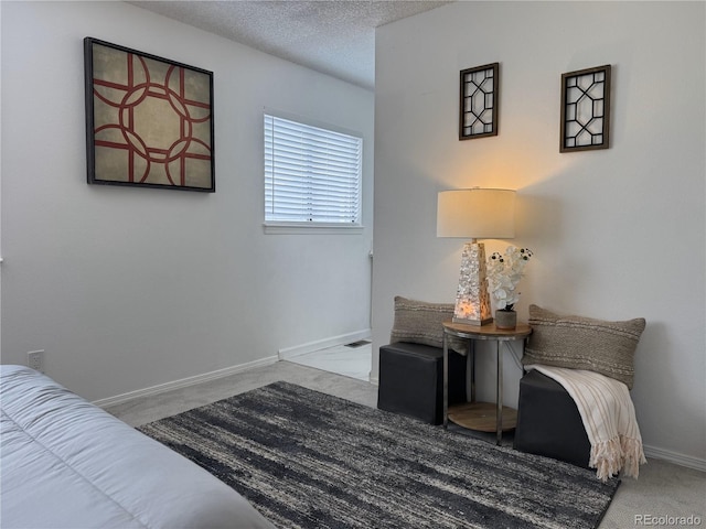180 S Nome St, Aurora, CO 80012 - bedroom featuring baseboards, carpet flooring, and a textured ceiling