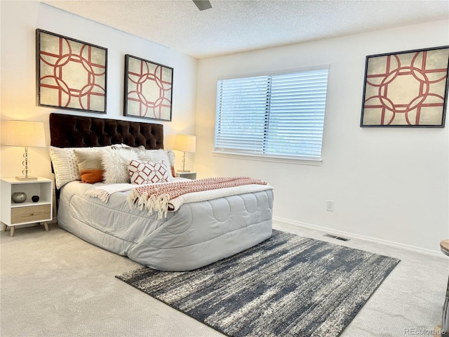 180 S Nome St, Aurora, CO 80012 - bedroom with carpet, a textured ceiling, baseboards, and a ceiling fan