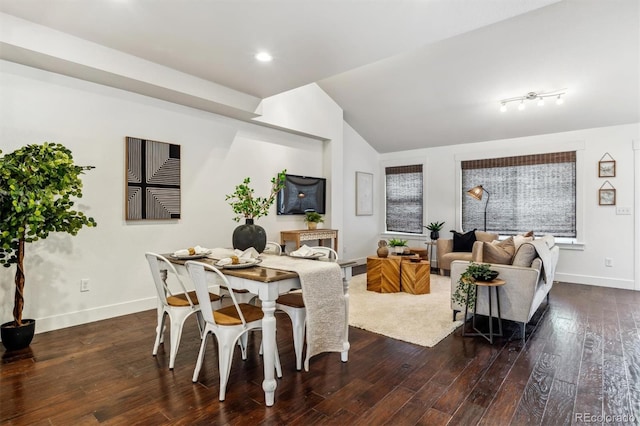 living room featuring baseboards, hardwood / wood-style floors, and lofted ceiling