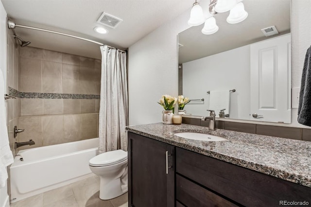 full bathroom with shower / bath combo with shower curtain, toilet, tile patterned floors, vanity, and a chandelier