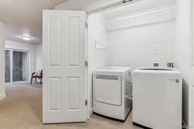 washroom with washing machine and dryer