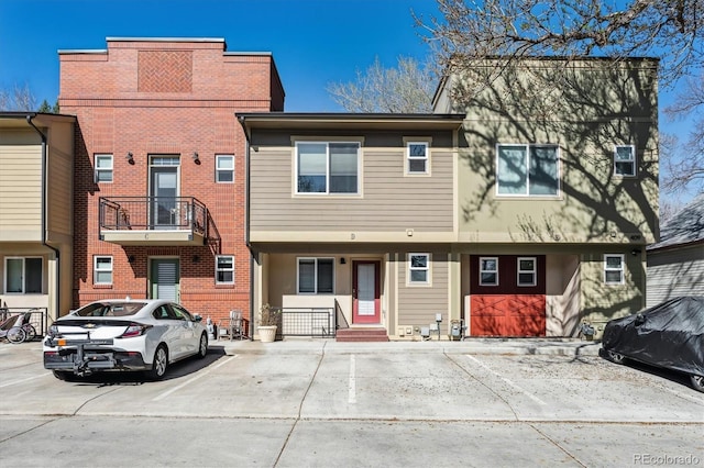 view of property with uncovered parking