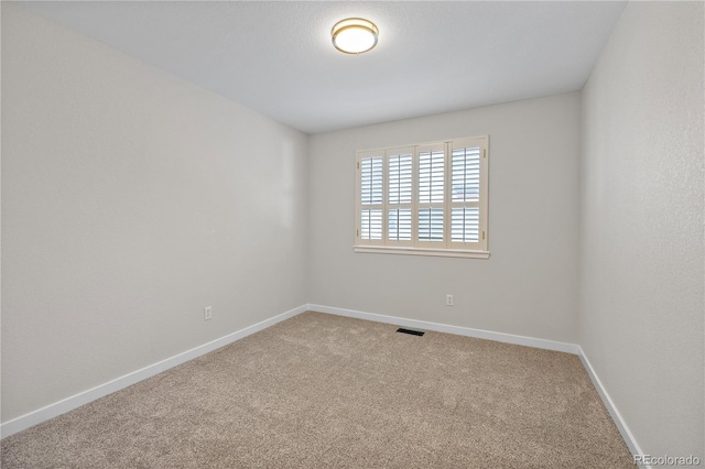 empty room featuring carpet floors