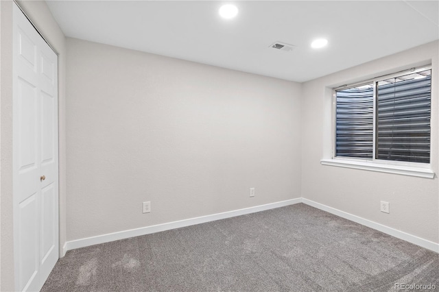 unfurnished bedroom with carpet floors and a closet